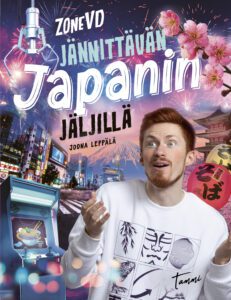 Kirjan kansikuva. Valokuvassa on ZoneVD ympärillään Japanista tuttuja asioita, kuten kirsikankukkia ja nuudelikulho.